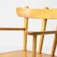 Danish organic armchair in solid birch, curved backrest, 1950s design.