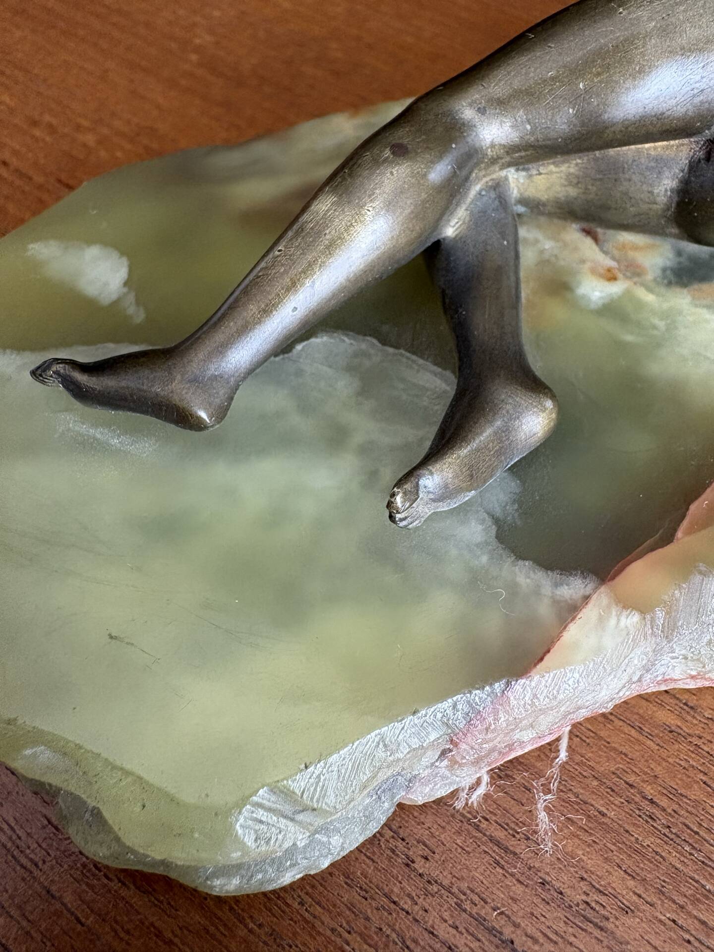 Art Deco female sculpture in bronze with onyx base.
