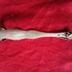 Silver sugar tongs with engraved decoration and lion claws.