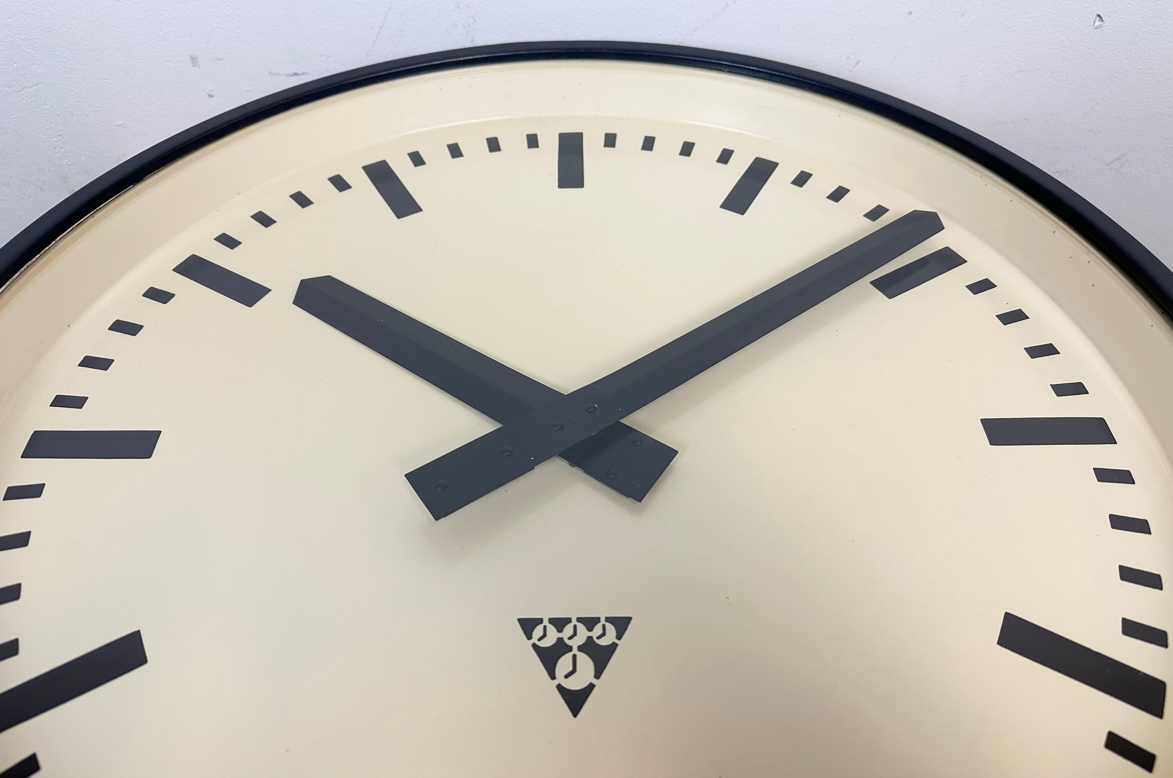 Grey industrial factory wall clock from pragotron, 1960s