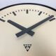 Grey industrial factory wall clock from pragotron, 1960s