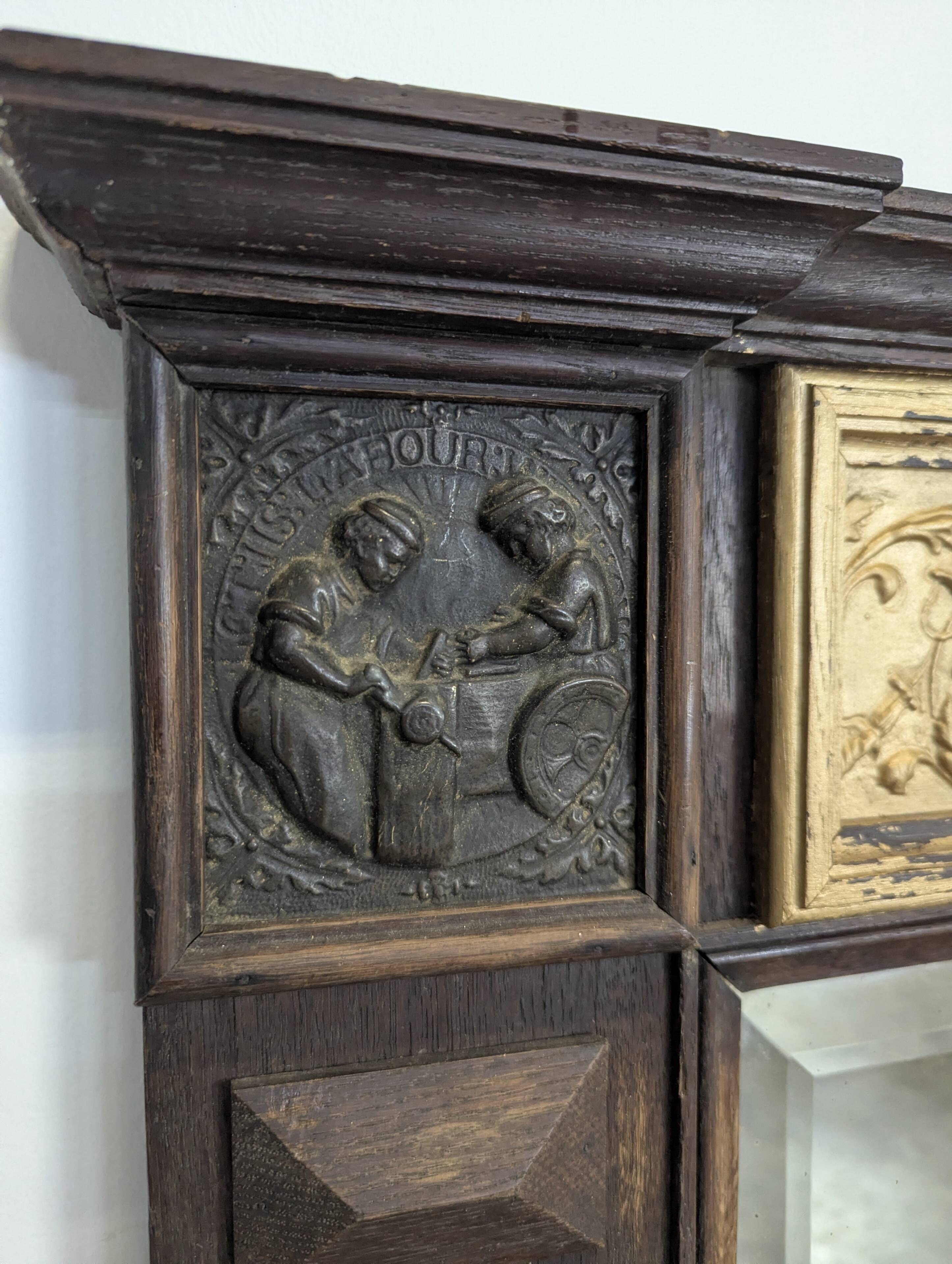 Renaissance-style mirror in wood and copper with a craftsmanship theme.