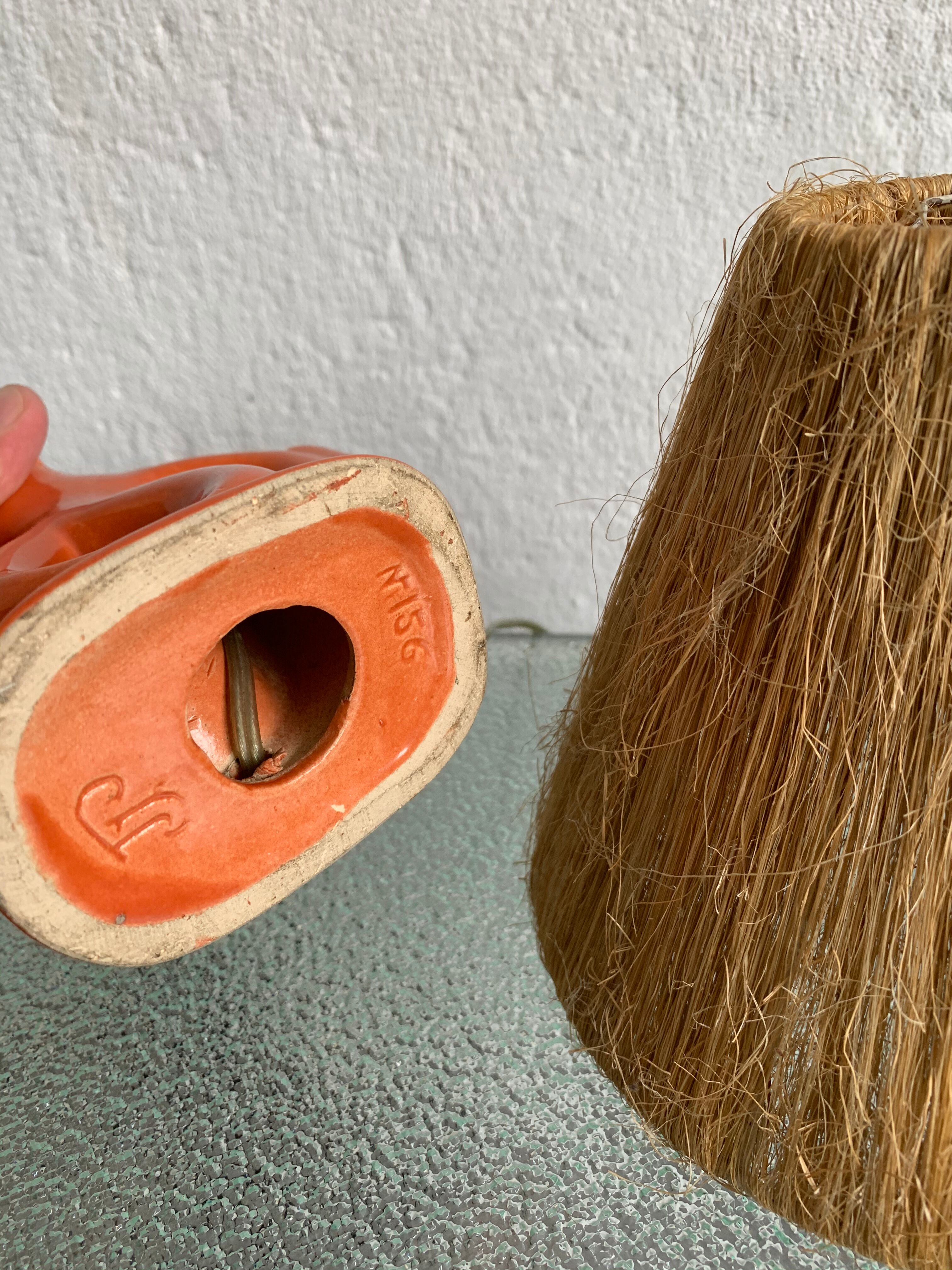 Vintage ceramic and raffia lamp