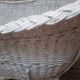 Wicker and painted wood baby cradle