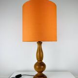 Turned wood lamp with orange shade, 1970s.