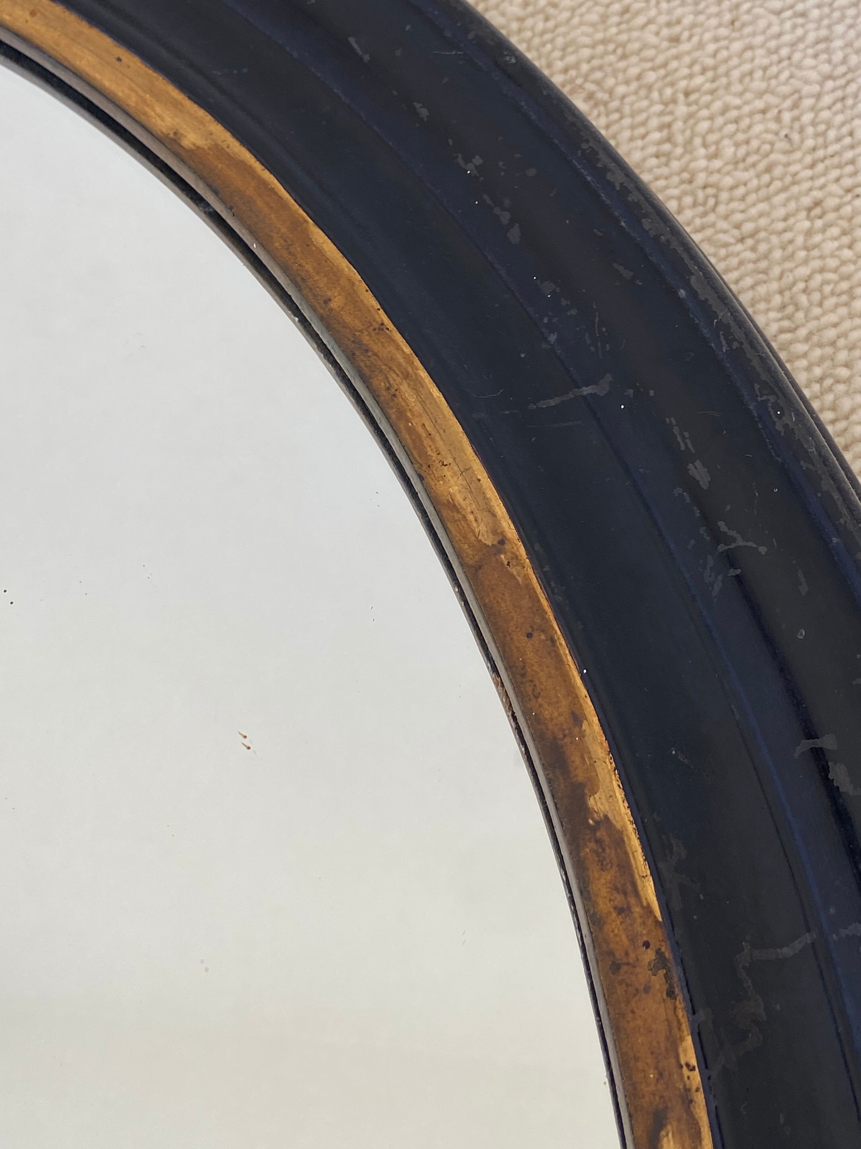 Black oval mirror, 19th century