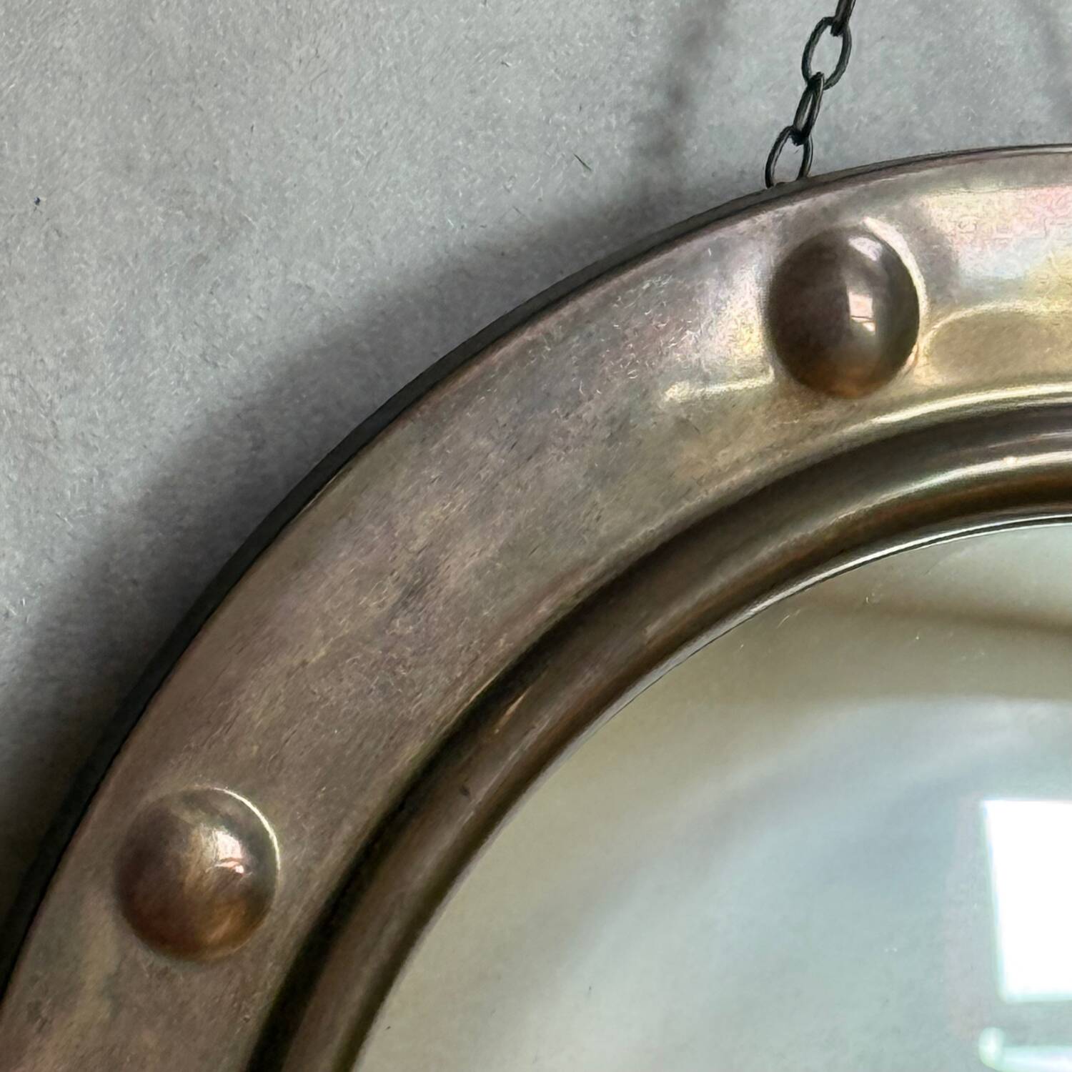 50s French porthole-style witch mirror with convex glass.