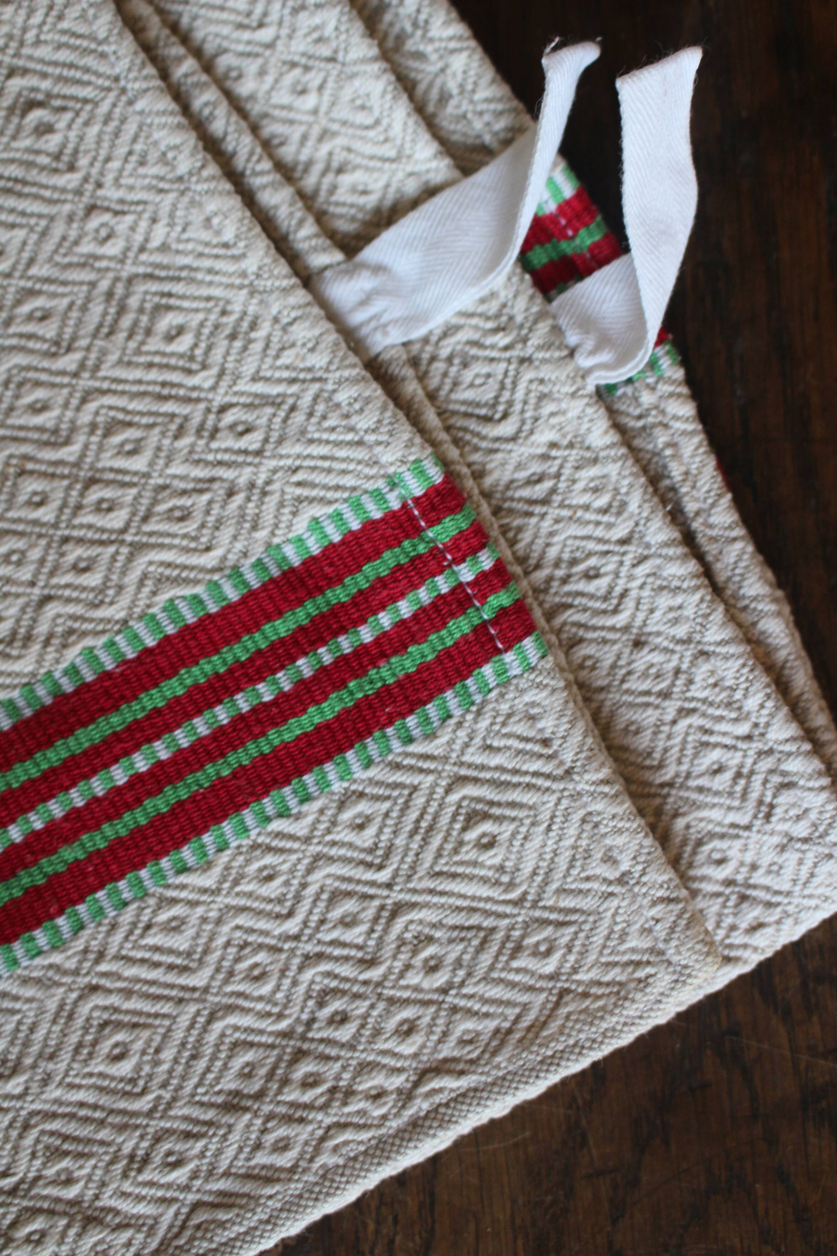 Old chevron towel with red and green stripes.