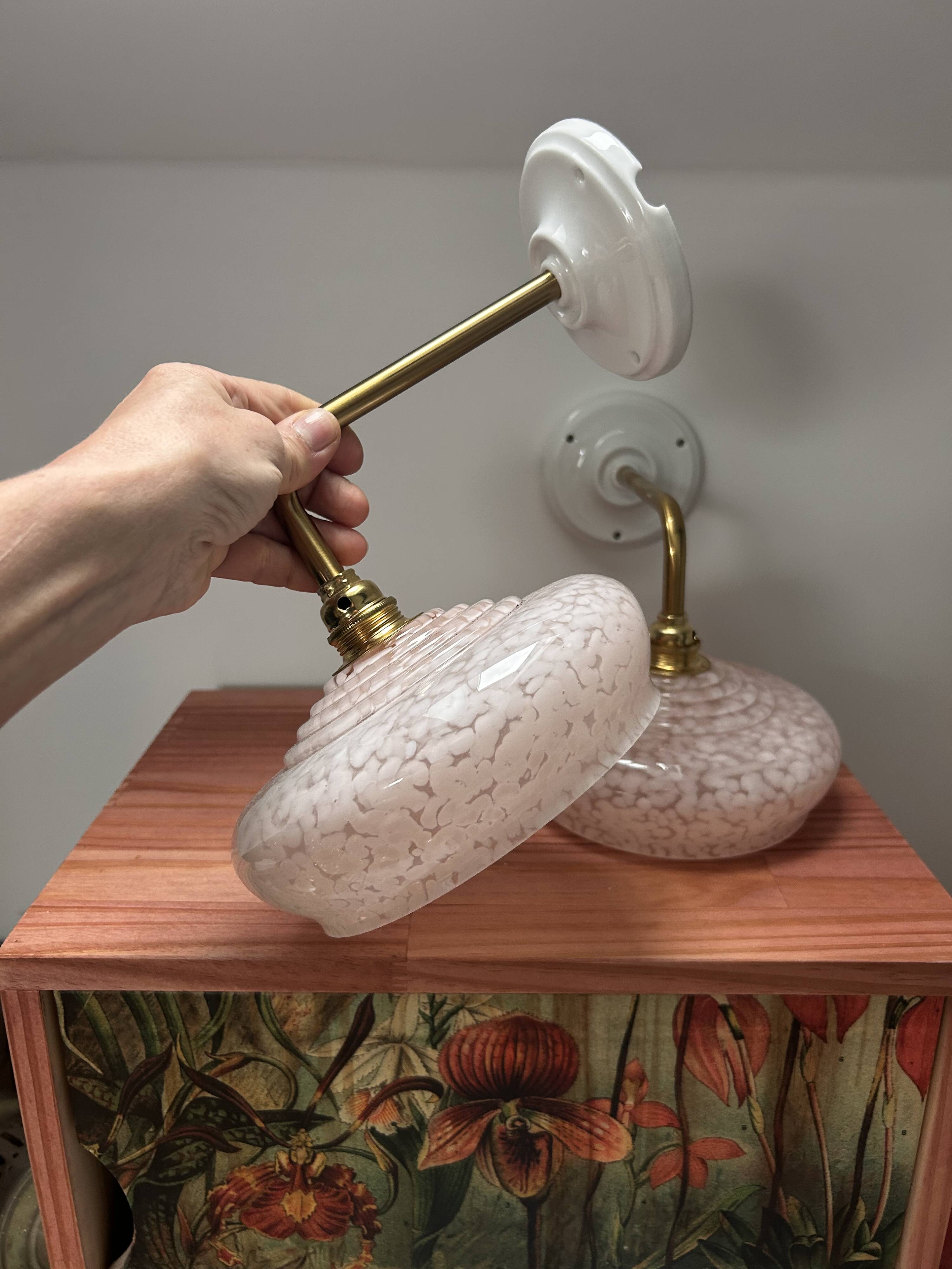 Pair of pink globe wall lights