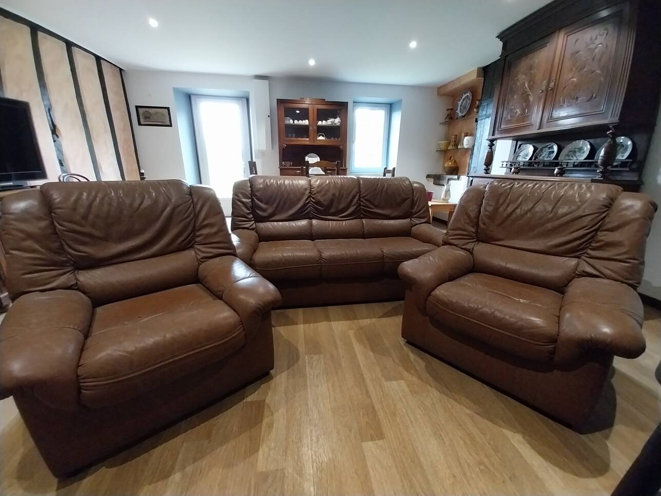 three-seater sofa and two armchairs