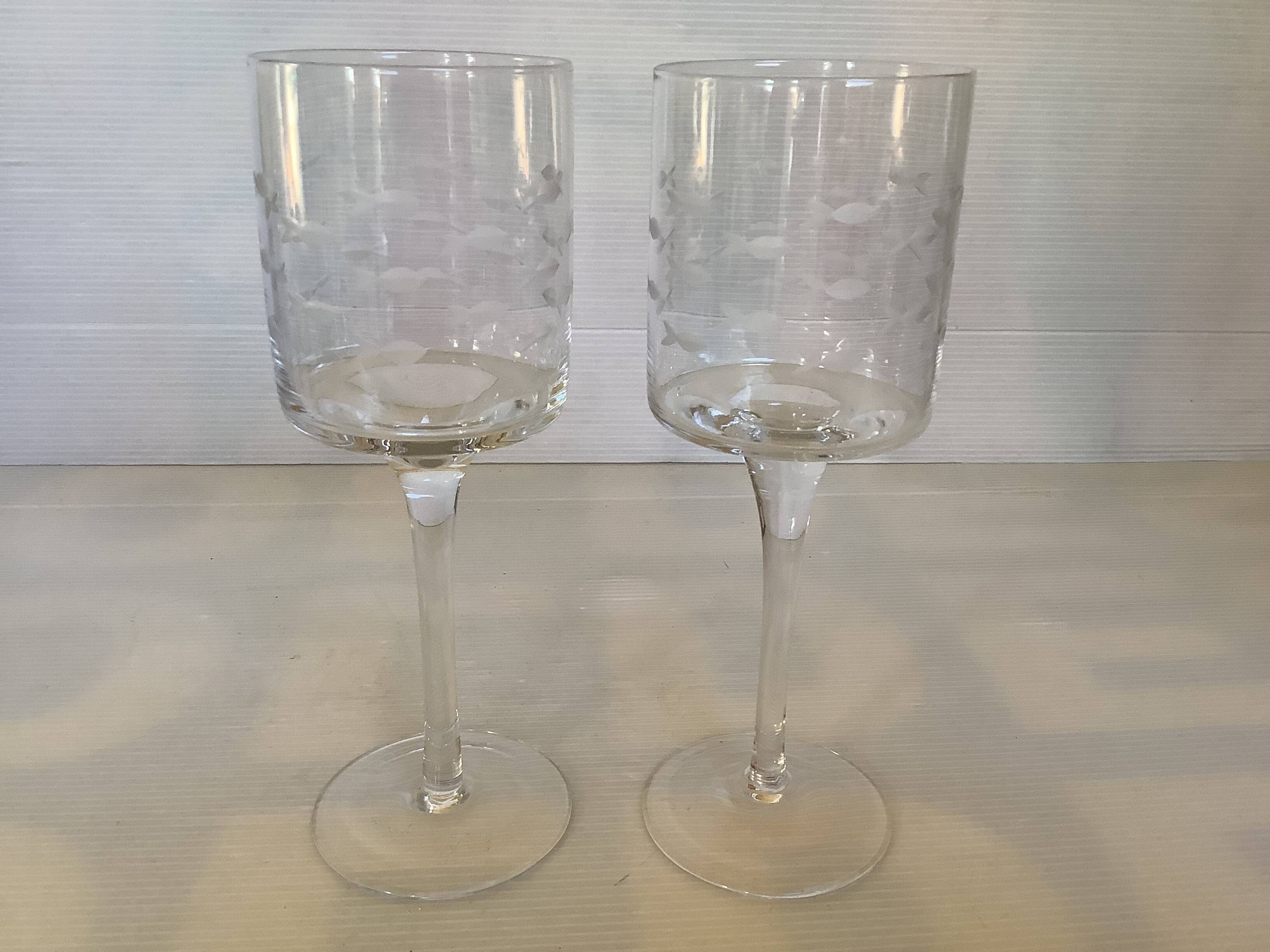 Duo of cut glass fish candle holders