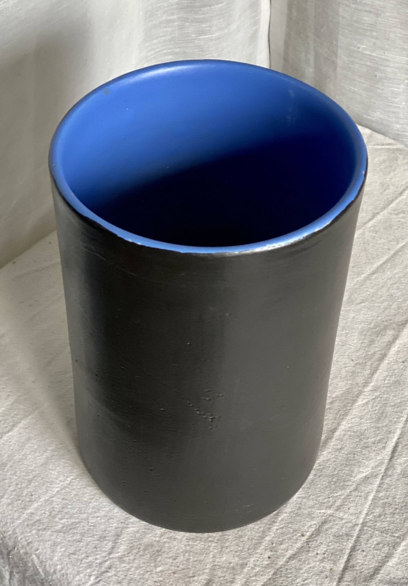 Vintage 1970s black ceramic roll vase signed Dumez.