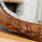 Beveled mirror in carved wood