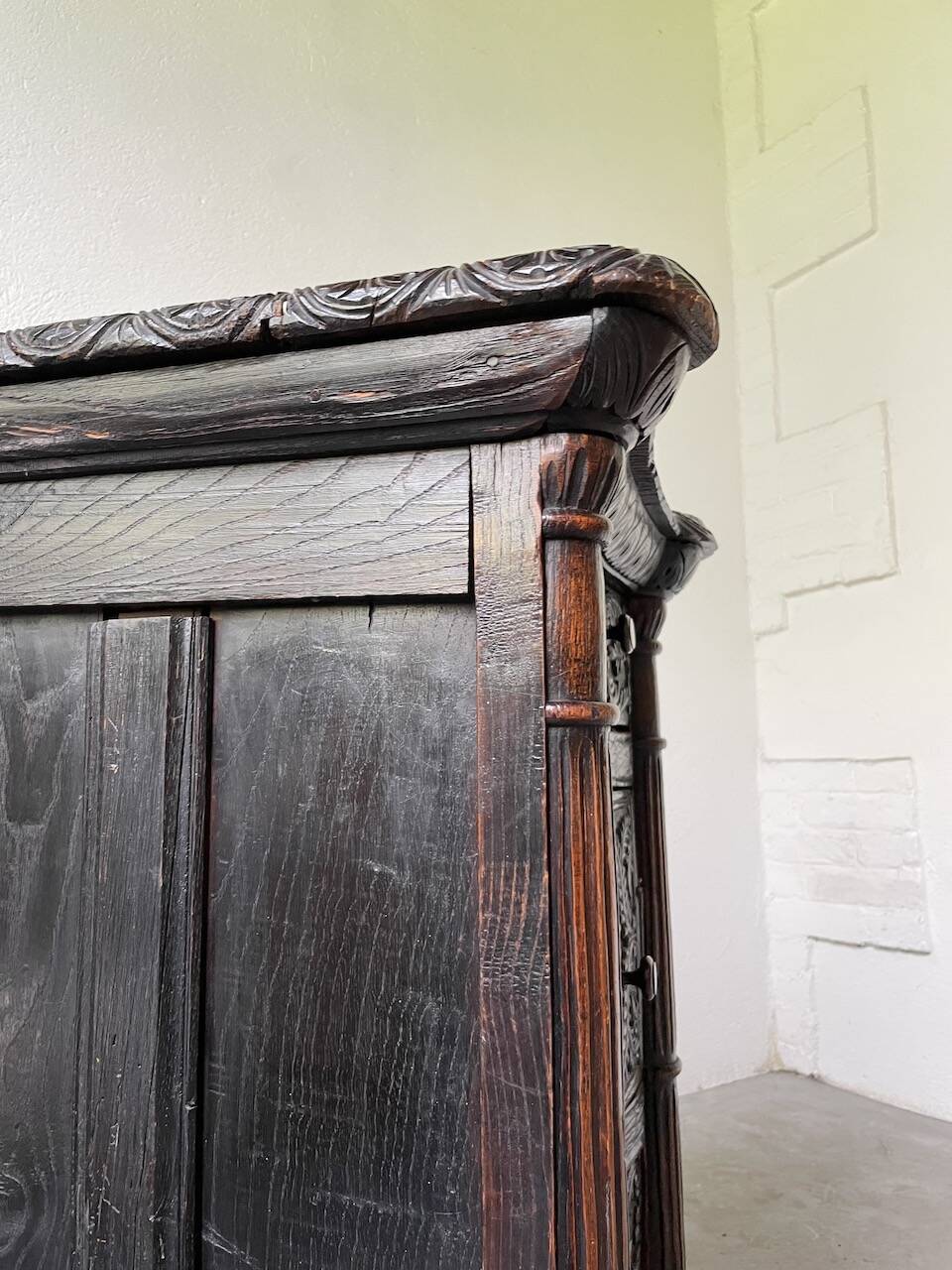 19th century chest of drawers in carved blackened pine