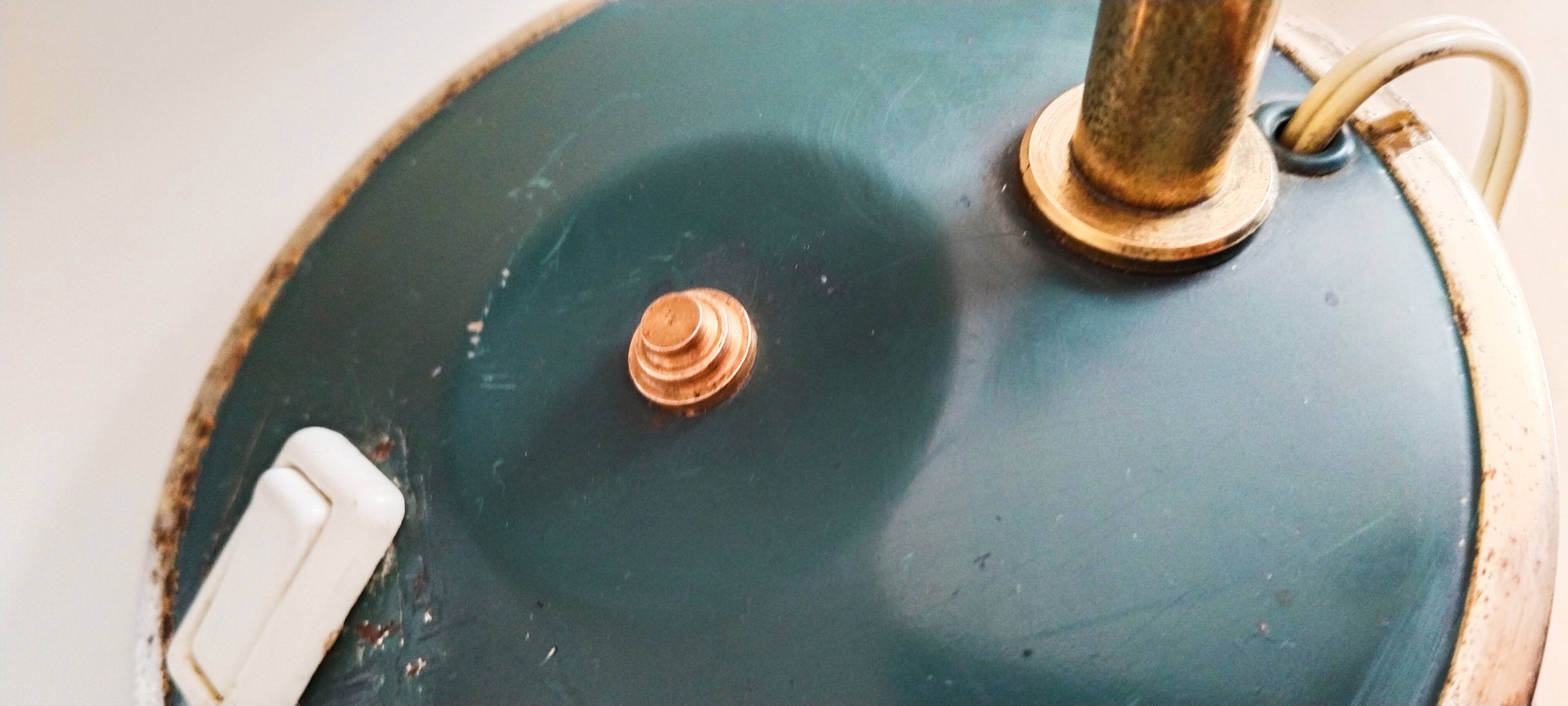 Green and gold articulated desk lamp