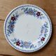 Vintage Gien earthenware flat plate with floral pattern on the border