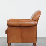 Cognac-colored cowhide leather armchair