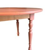 Round wooden table with folding sides
