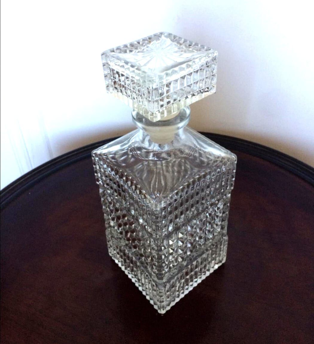 Pair of vintage diamond-cut whiskey decanters
