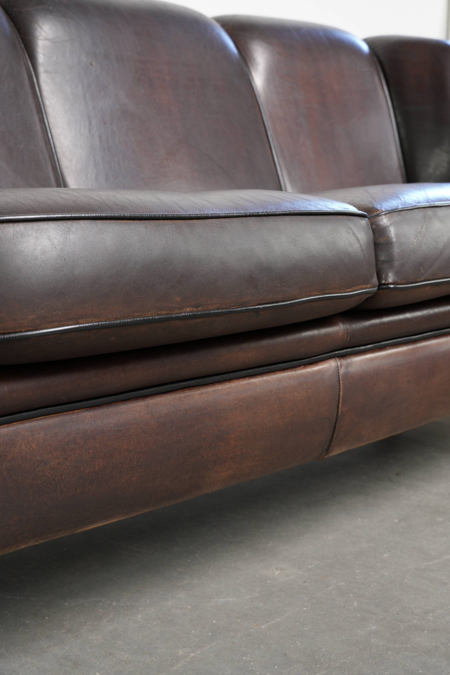 Unique sheepskin 3-seater sofa with deep colours and a distinctive design