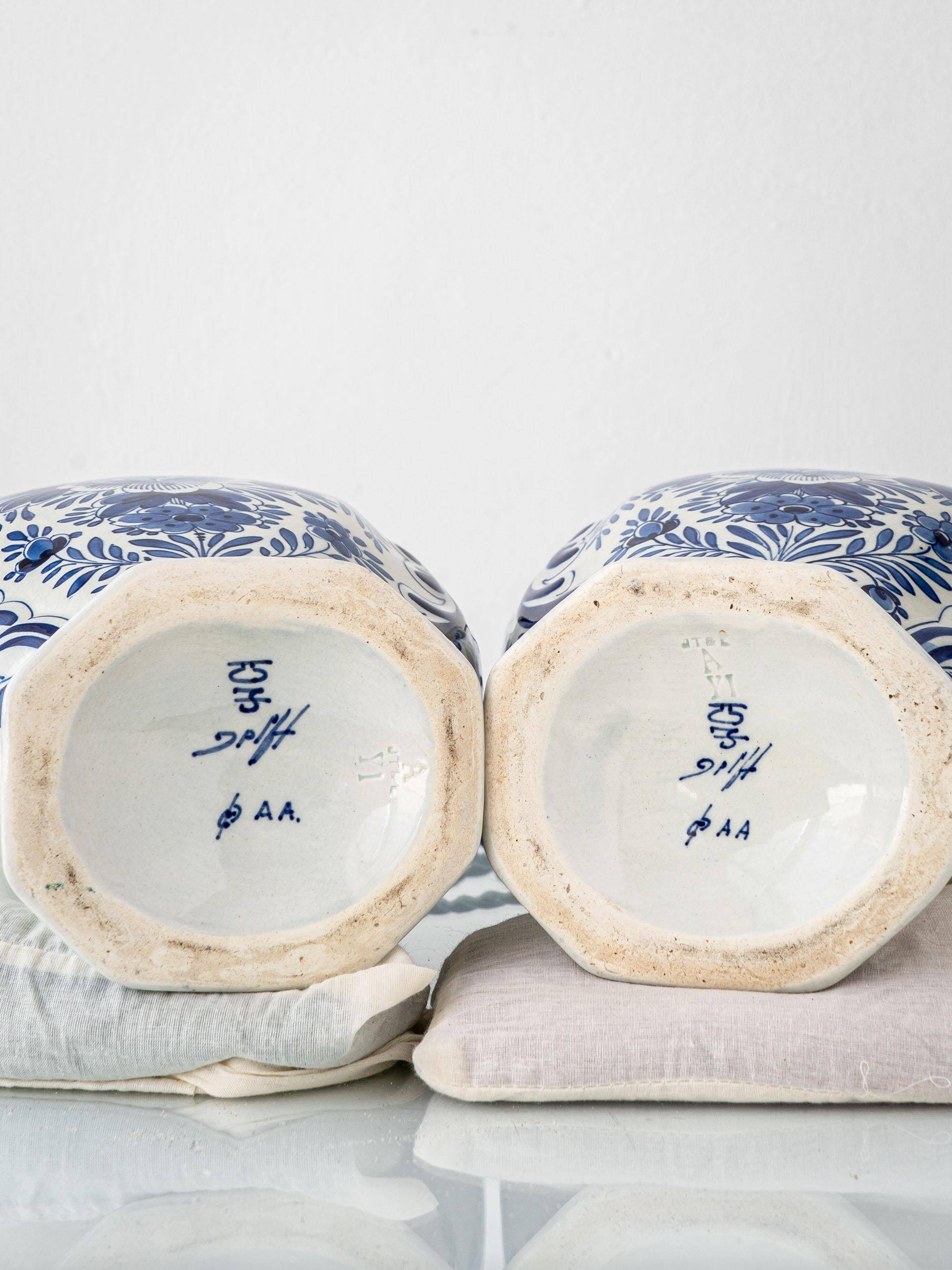 Pair of Royal Delft blue and white ceramic table lamps, 1905, with new pleated silk shades.