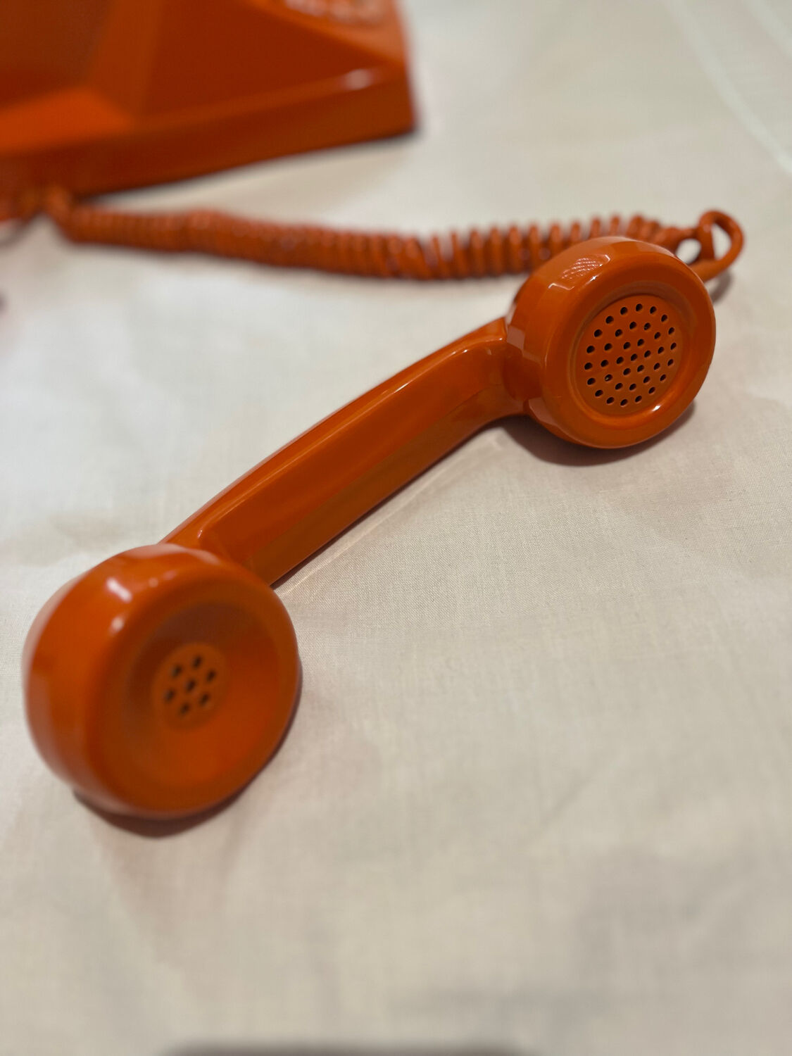 Orange vintage phone with socotel dial