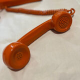 Orange vintage phone with socotel dial