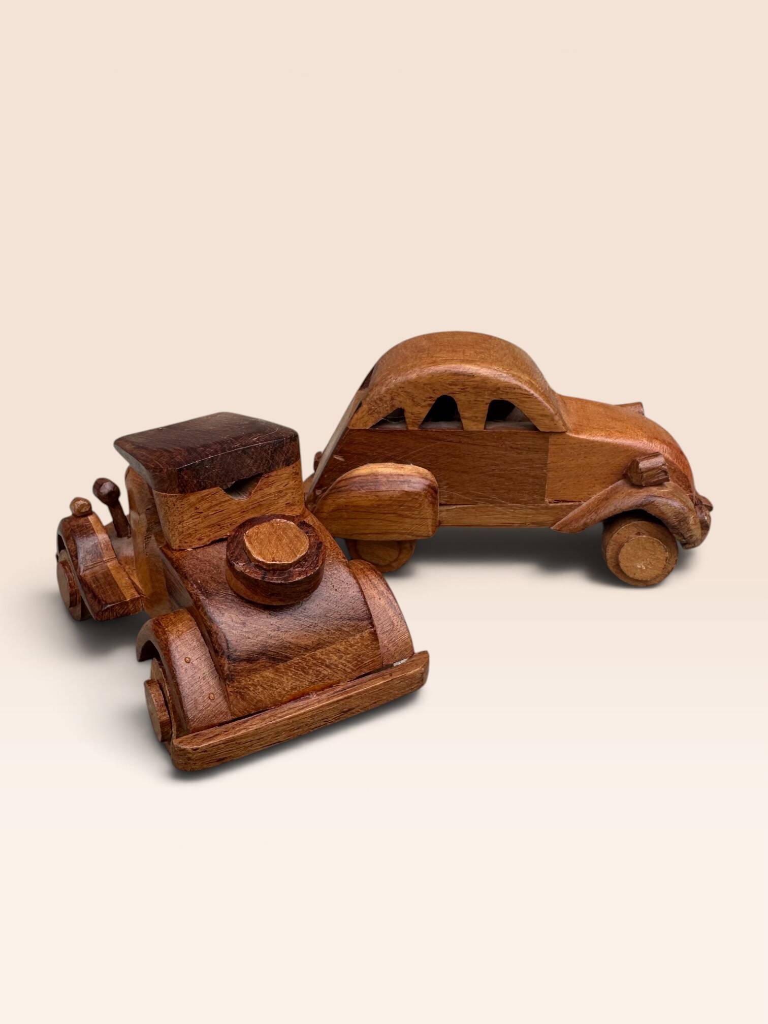 Pair of small handcrafted wooden cars