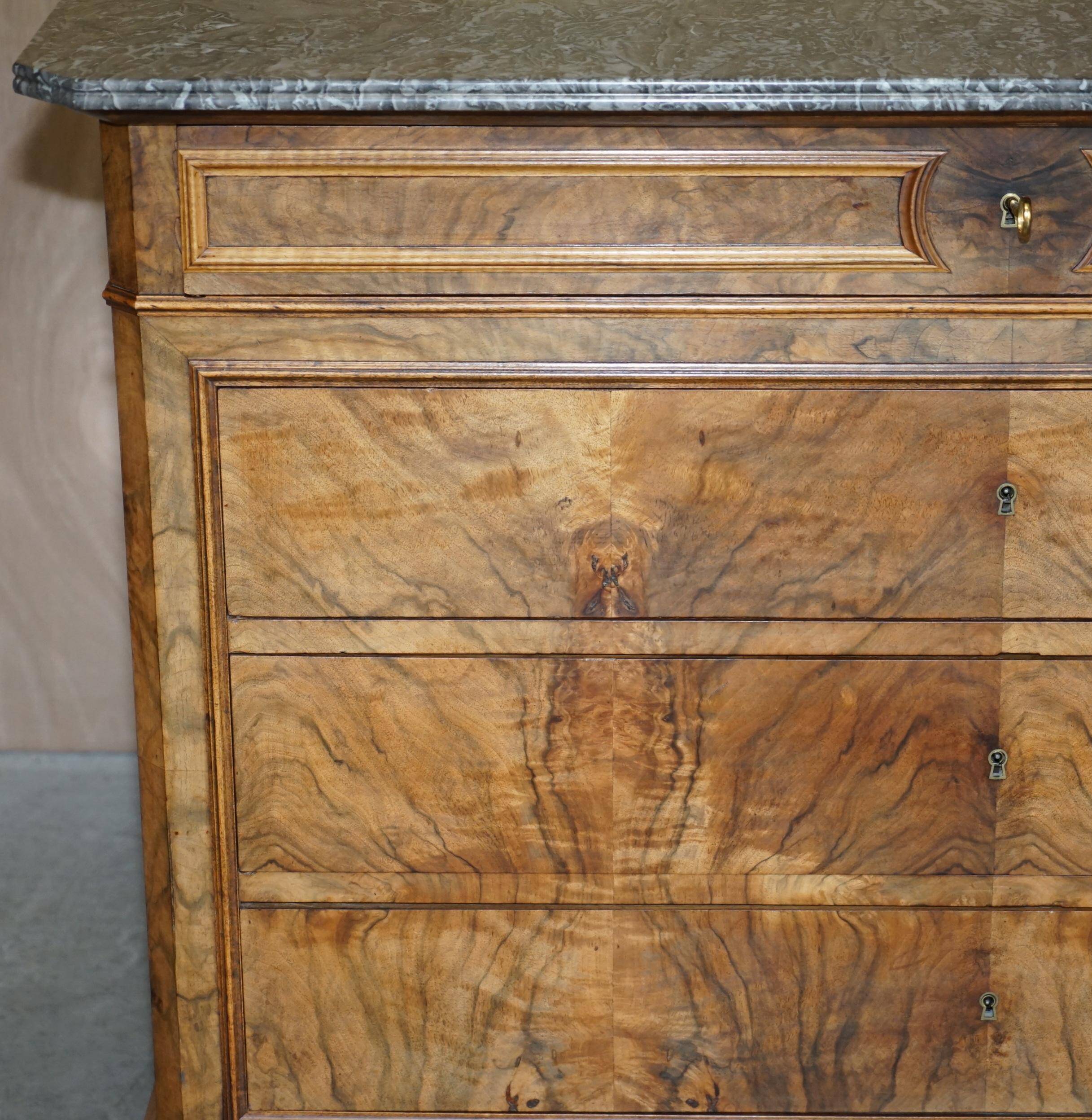 Antique walnut commode from 1860 with a marble top and original key.