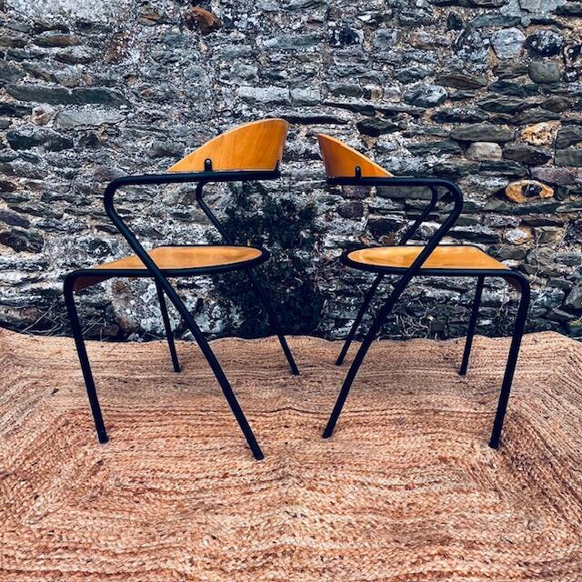 Pair of wooden and black metal chairs