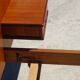 Antique teak bed with integrated bedside table