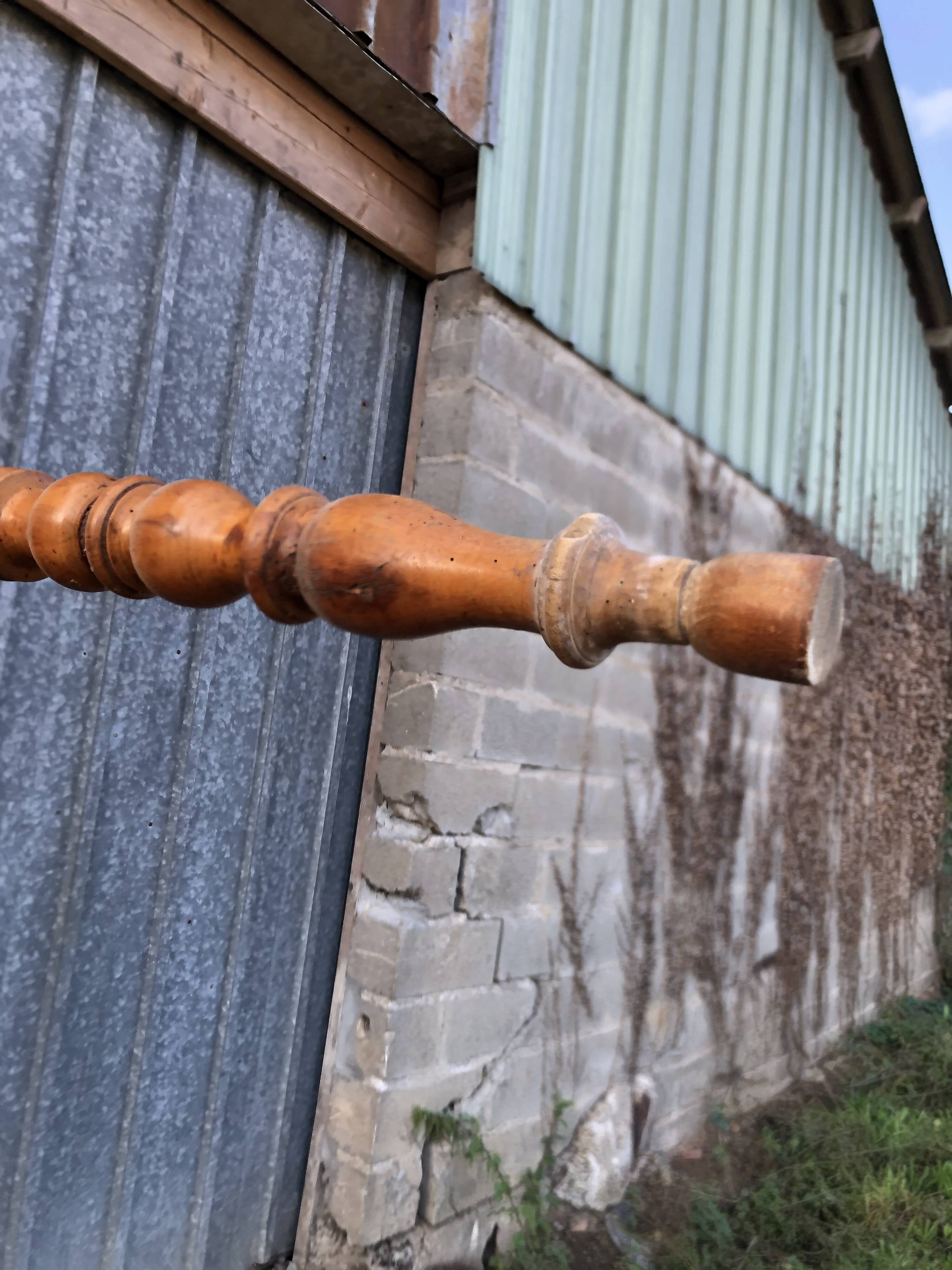 Antique farmhouse table in solid cherry wood with turned legs.