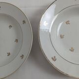 Set of 2 white deep plates with a gold pattern.