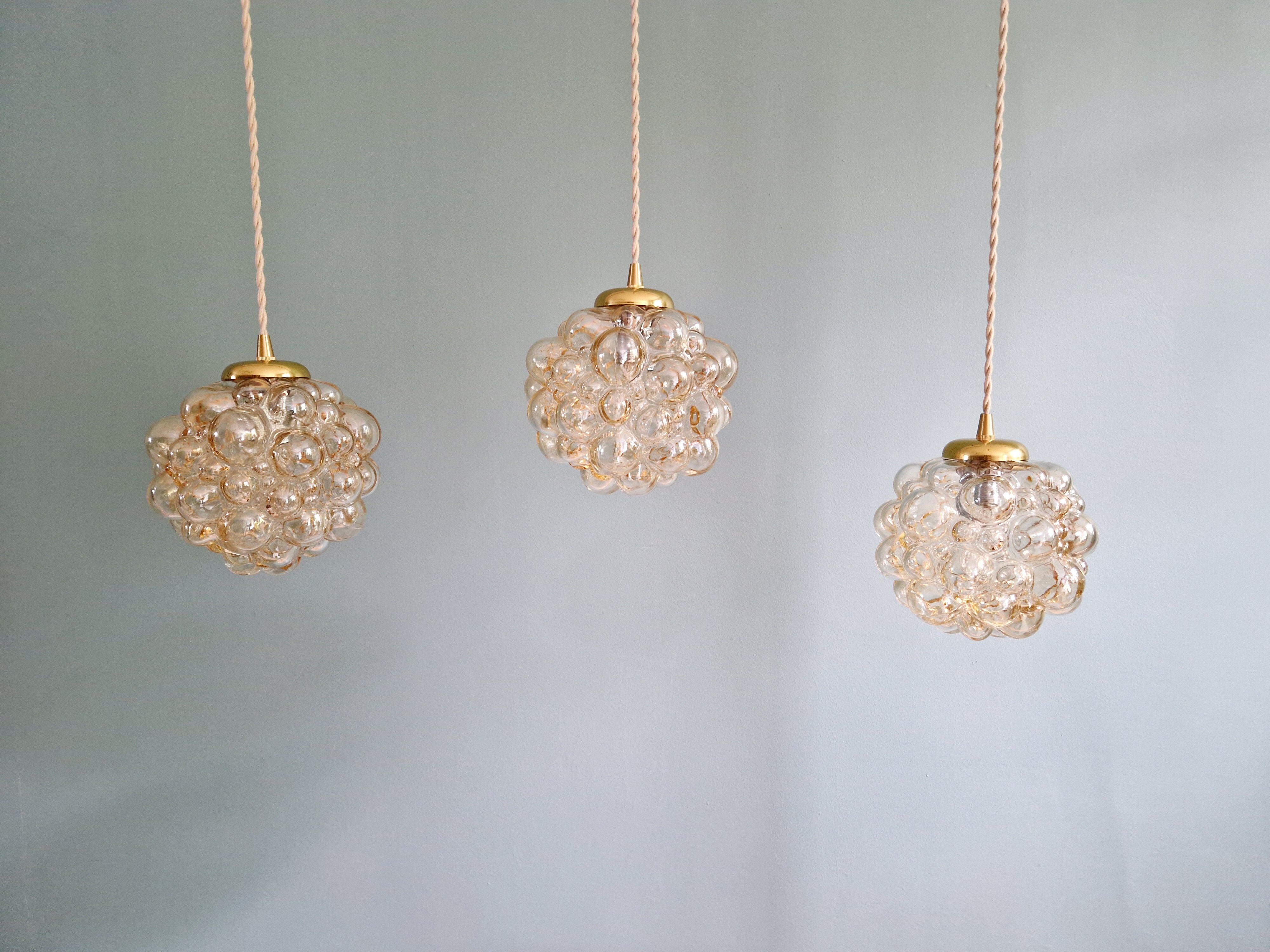 Amber bubble glass pendant (3 available), design by Helena Tynell, 1970.