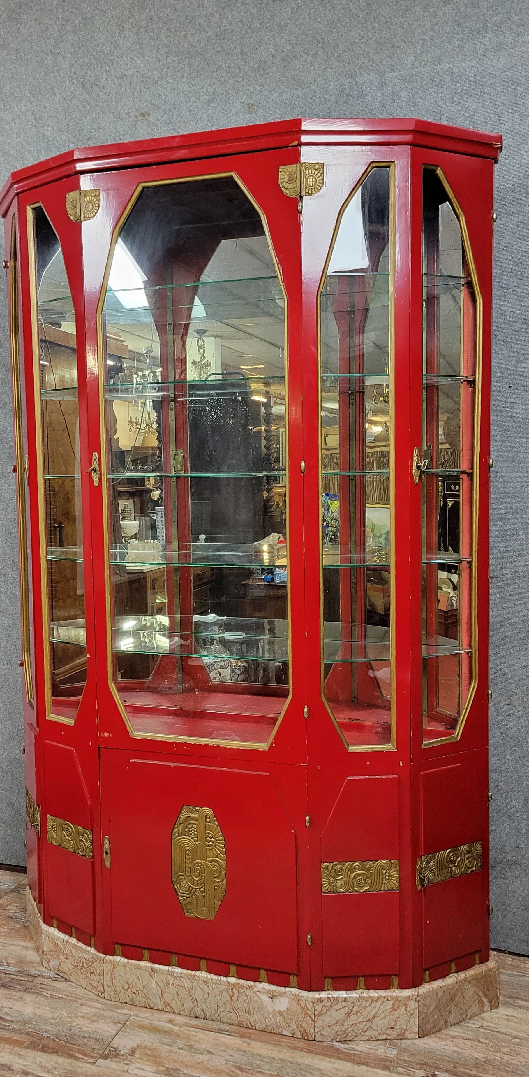 Important Art Deco period bookcase in lacquered wood and gilded bronze