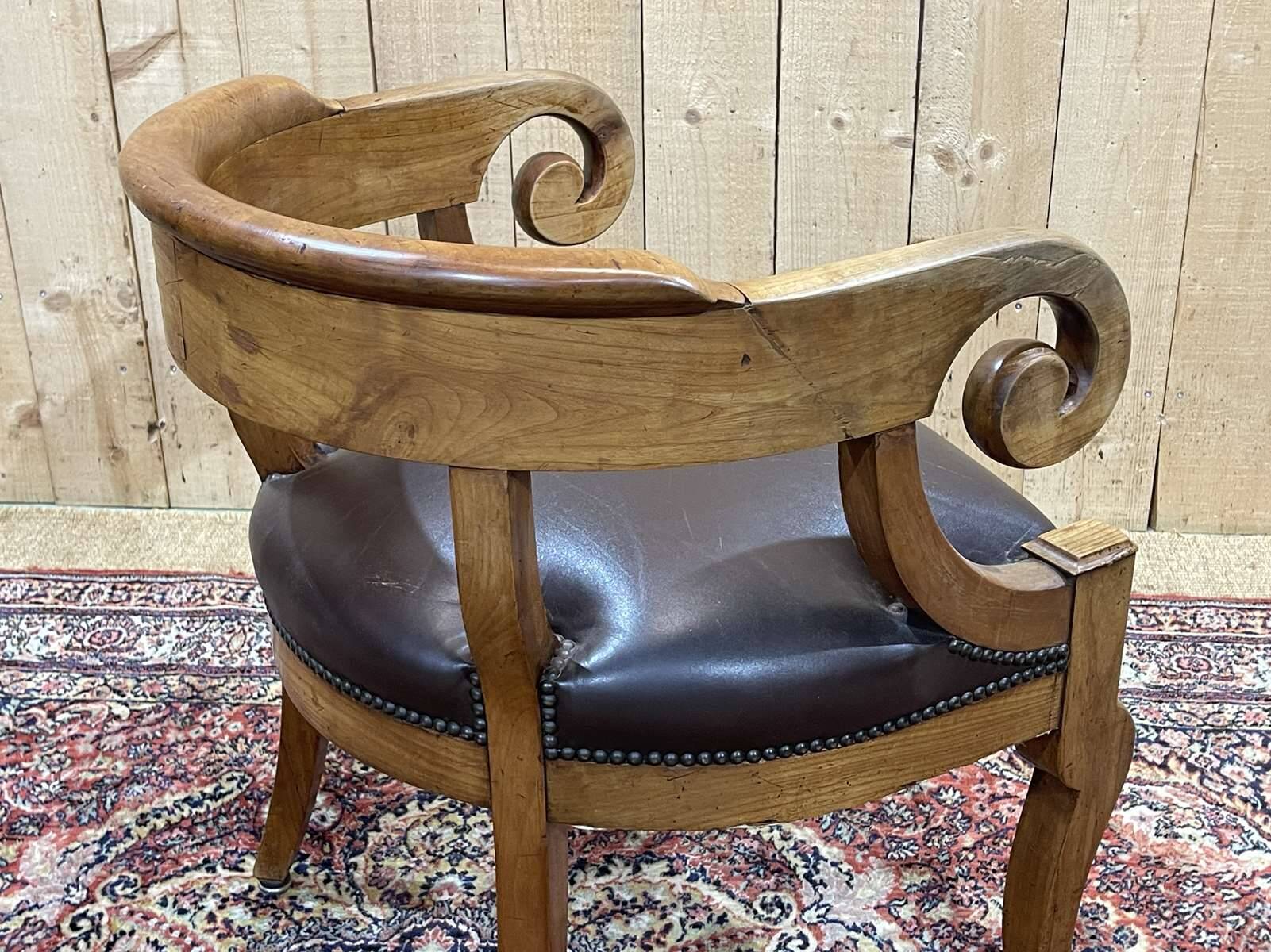 19th century French armchair in cherry wood and leather seat