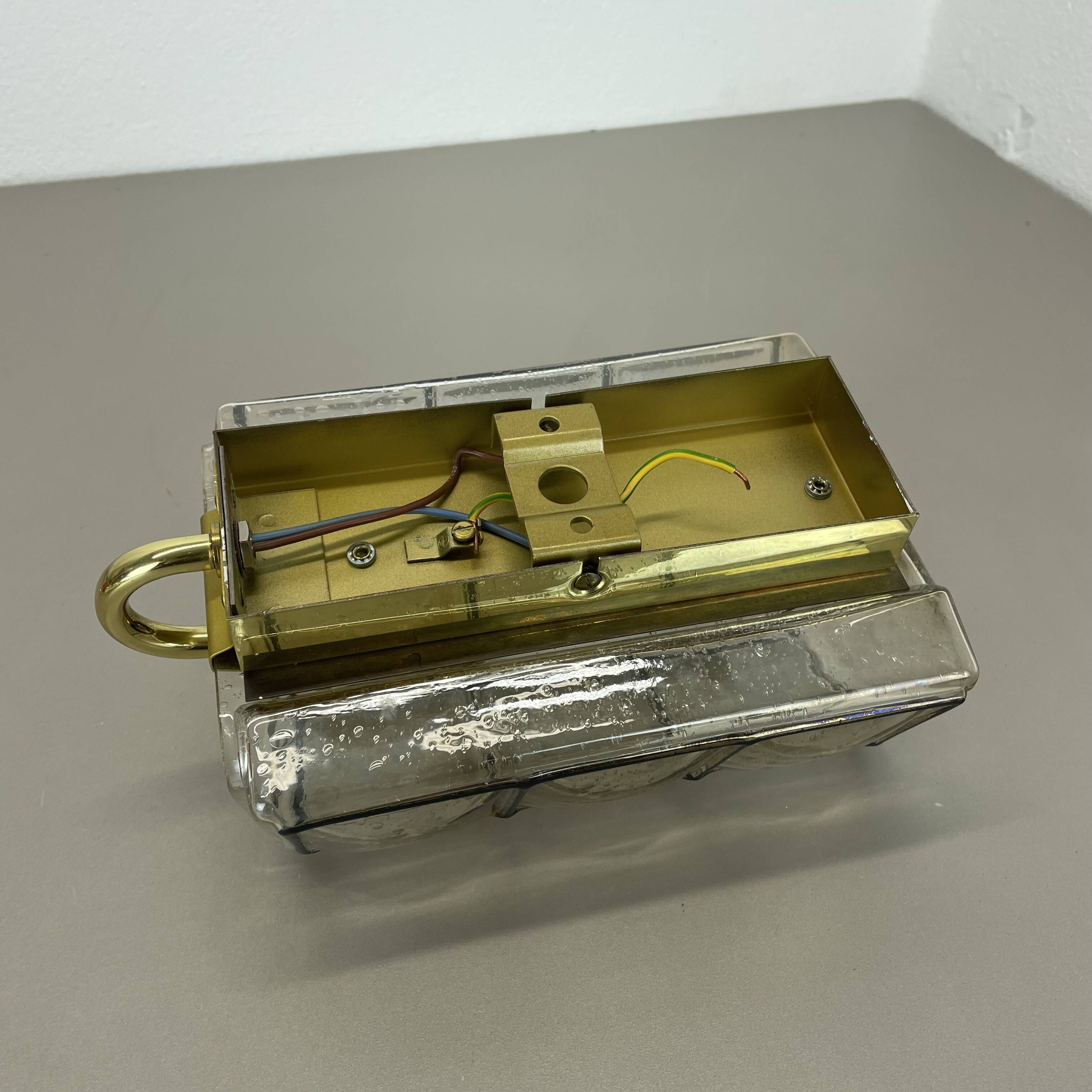 Wall light "Iron Rings" in brass and glass by Glashütte Limburg, Germany, 1970s