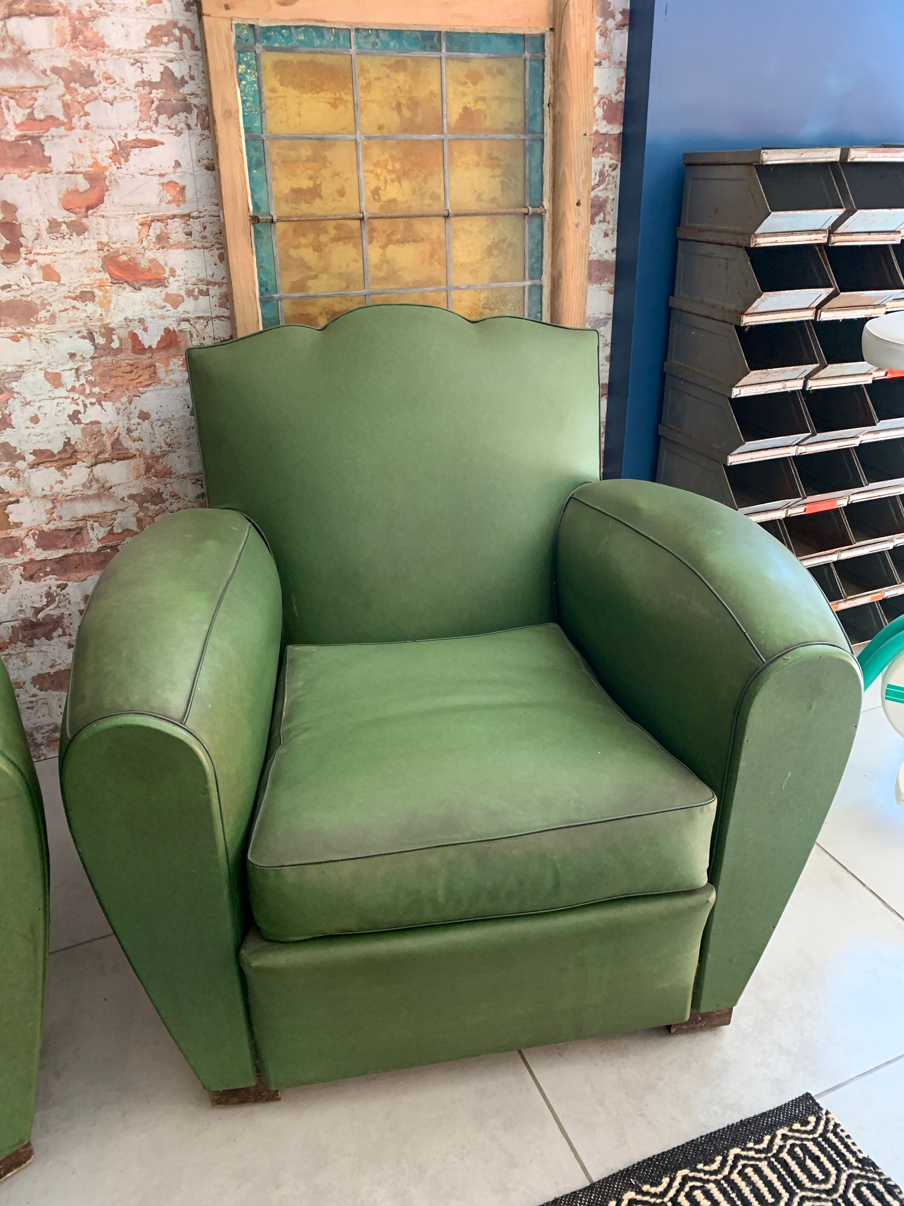 Pair of mustache club armcairs in green skai