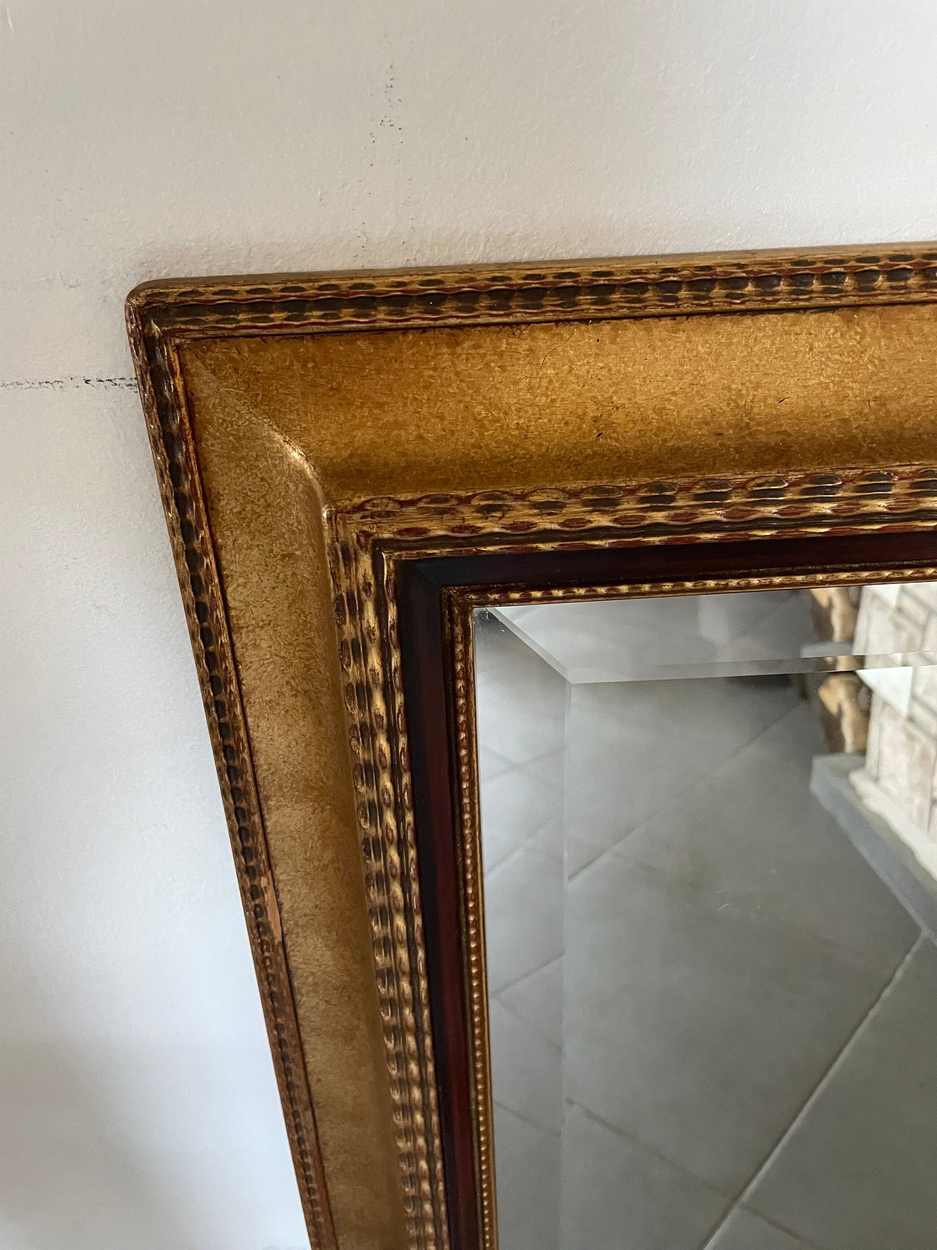 Mirror gilded frame black net and beveled ice used