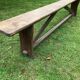 Old solid wood farm bench
