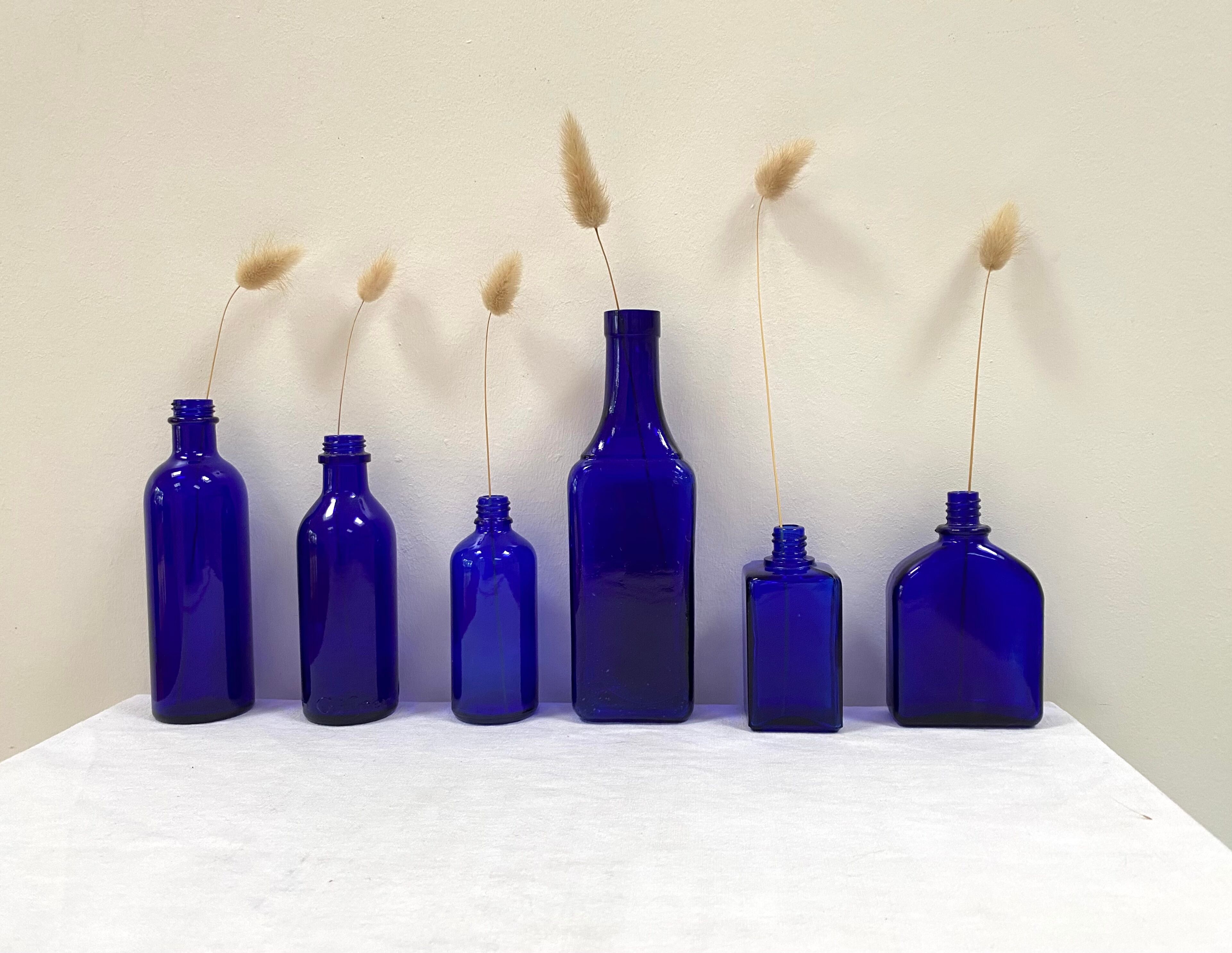 Set of 6 cobalt blue glass pharmacy bottles