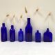 Set of 6 cobalt blue glass pharmacy bottles
