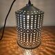 Industrial pendant lamp in perforated gray metal