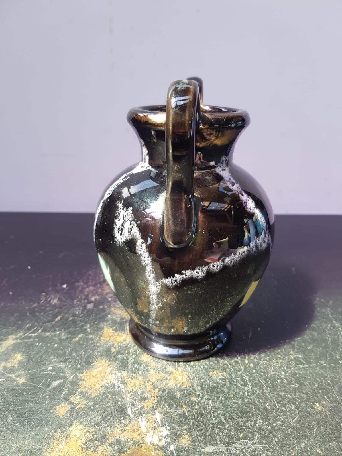 Old vase with coves ceramic black