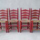 2 vintage red straw chairs