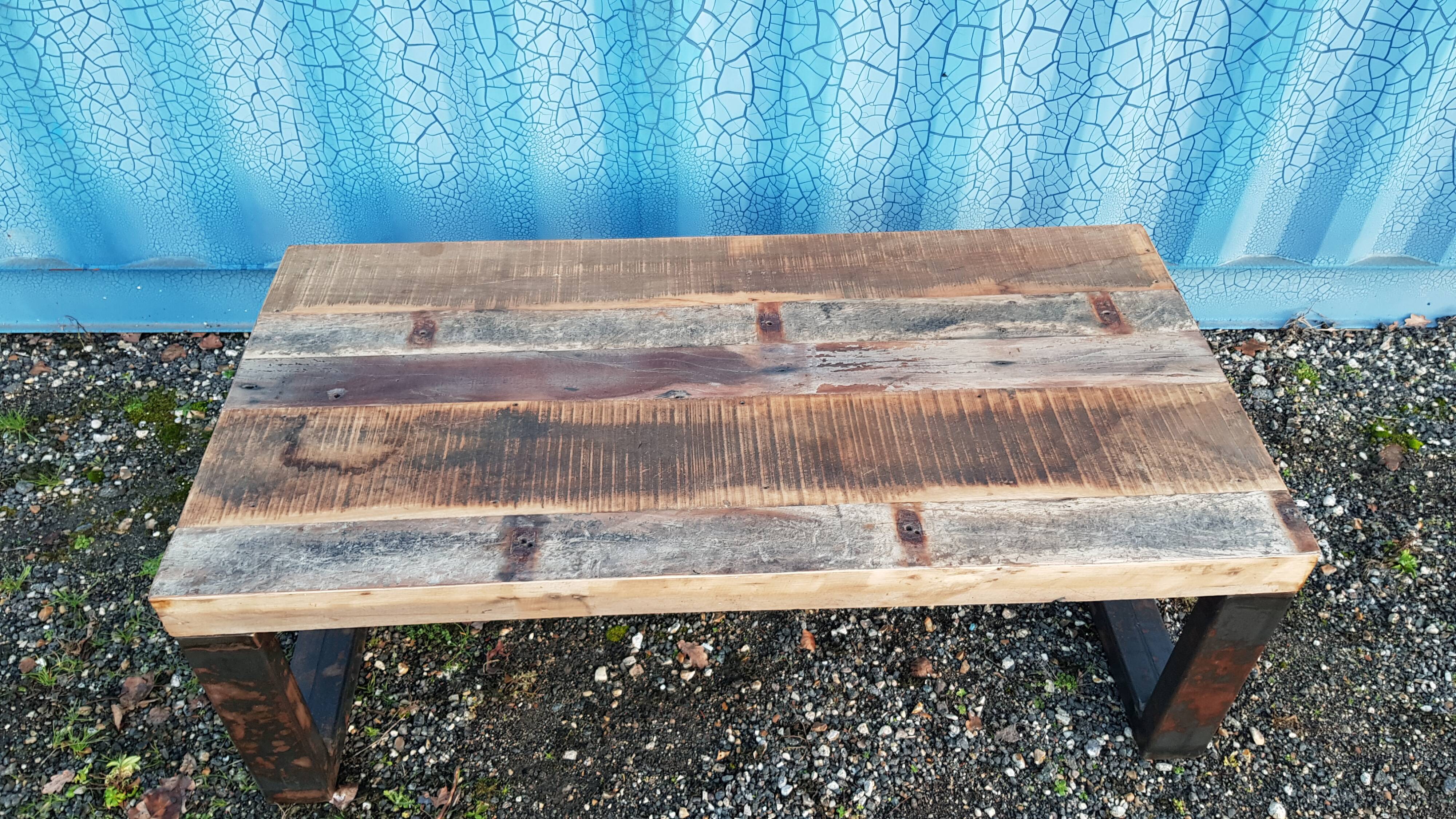 Industrial coffee table with wooden top and metal legs