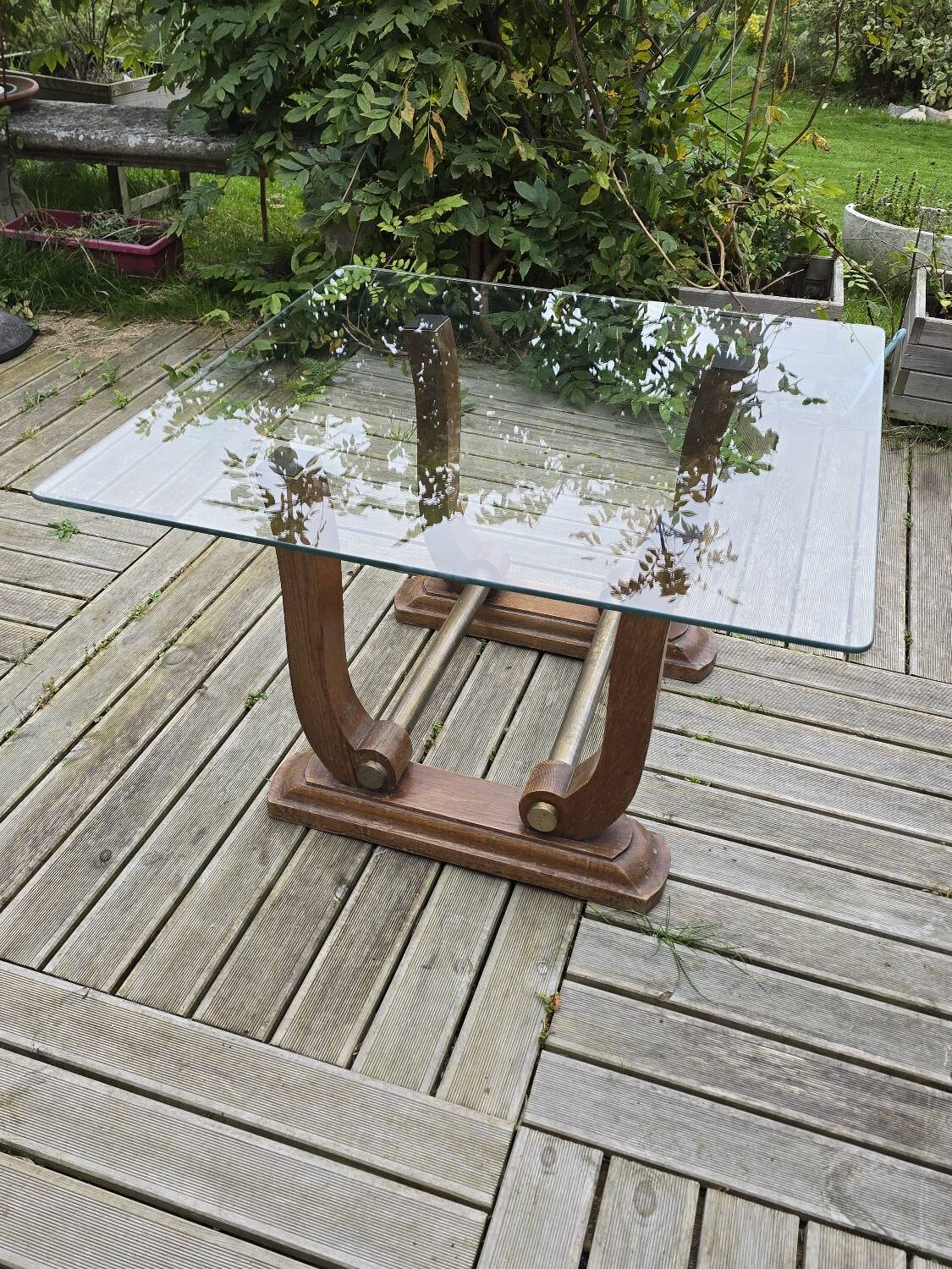 Art Deco coffee table in glass, wood, and brass.