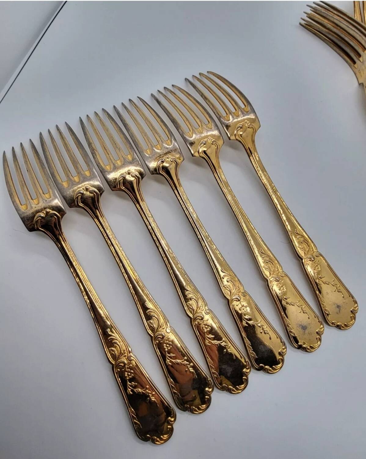 12 Table Forks in gold metal