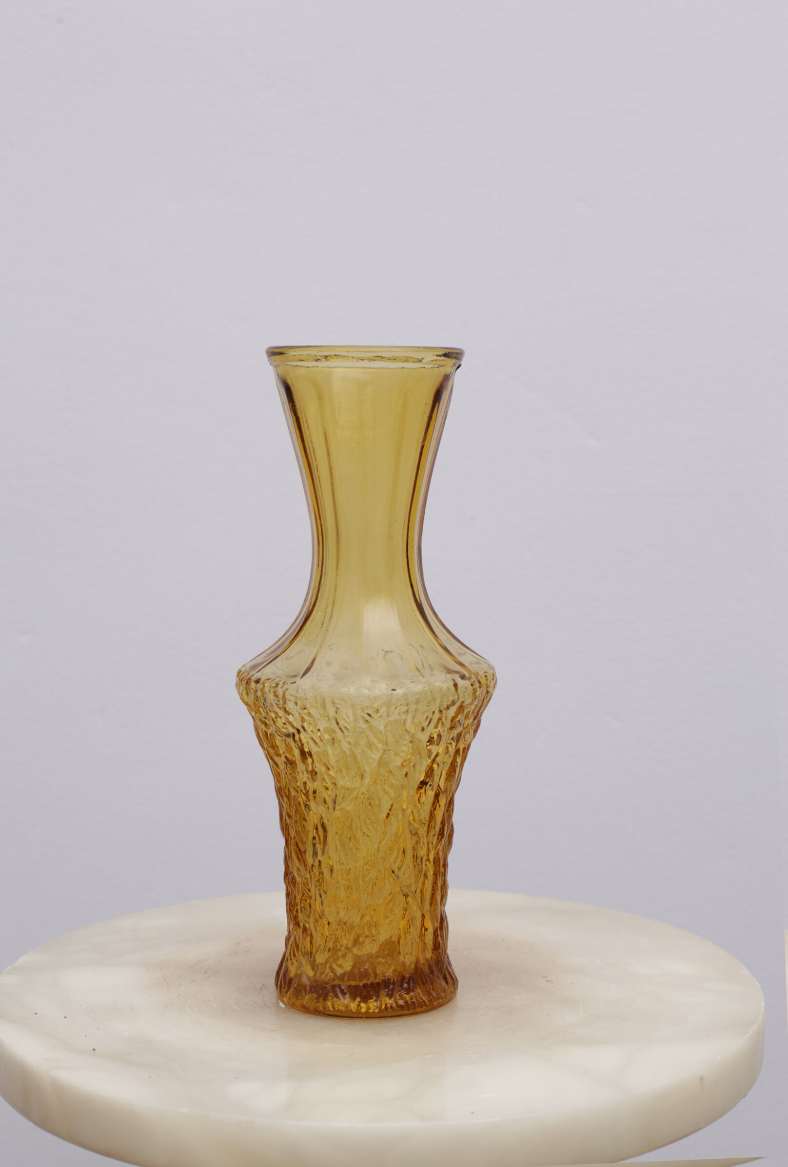 Yellow glass vase streaked and flared