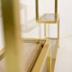 Vintage shelves in brass and smoked glass.